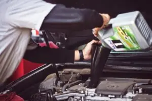 A person is holding an air pump in their hand.
